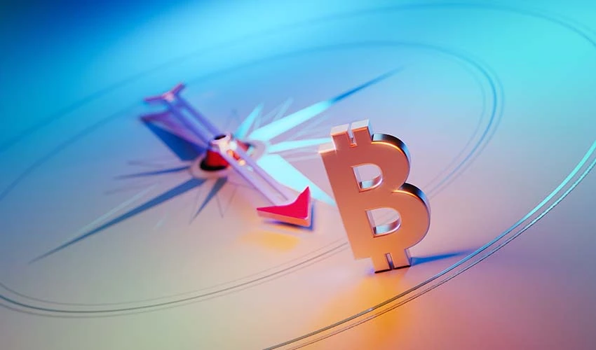 Compass pointing to Bitcoin symbol