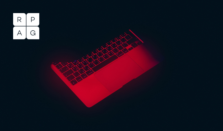 Laptop half closed with glowing red light