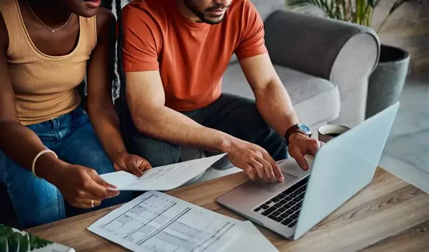 Couple doing taxes at table