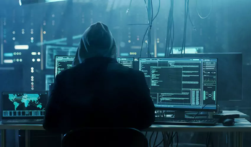Hacker at computers