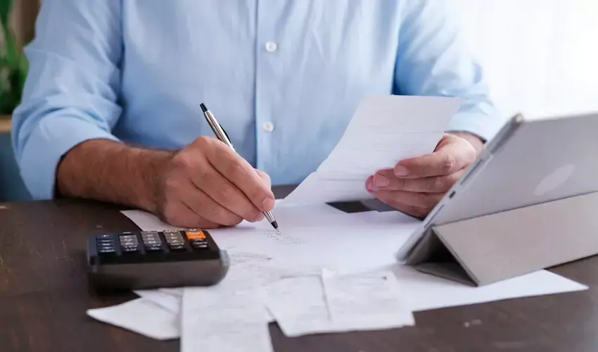 man going through paperwork