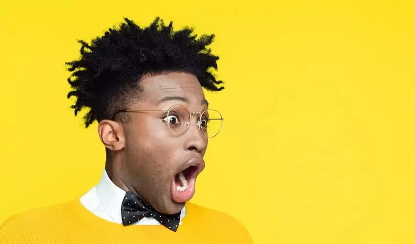 Man shocked with yellow background