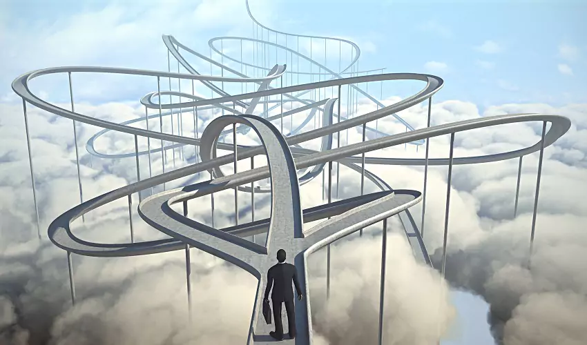 man standing at multiple crossroads