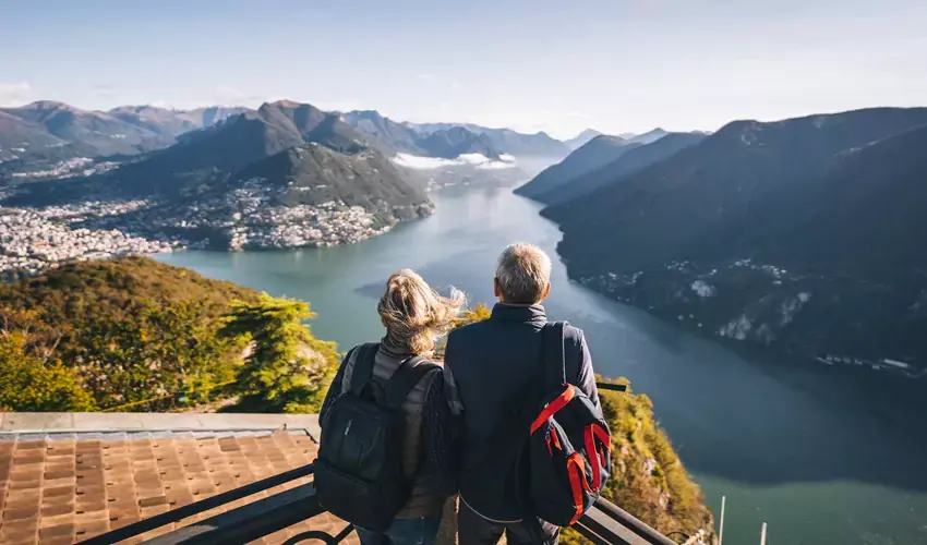 Retired couple looking out over lake