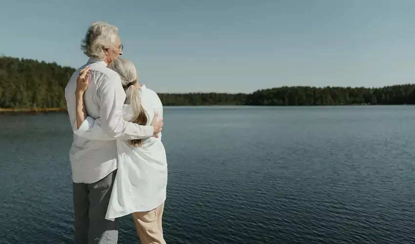 Retired couple looking over lake