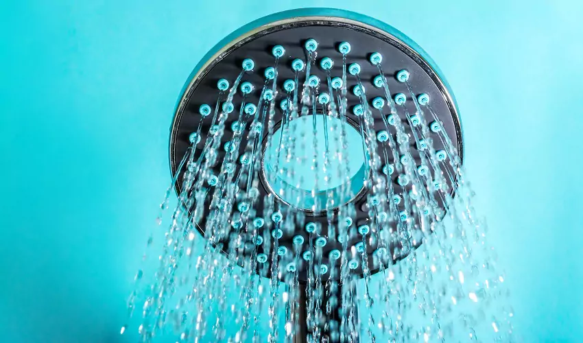 Shower head on with blue background