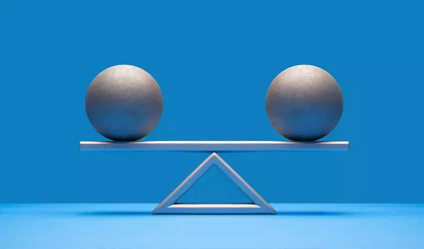 Two balls balancing on scale