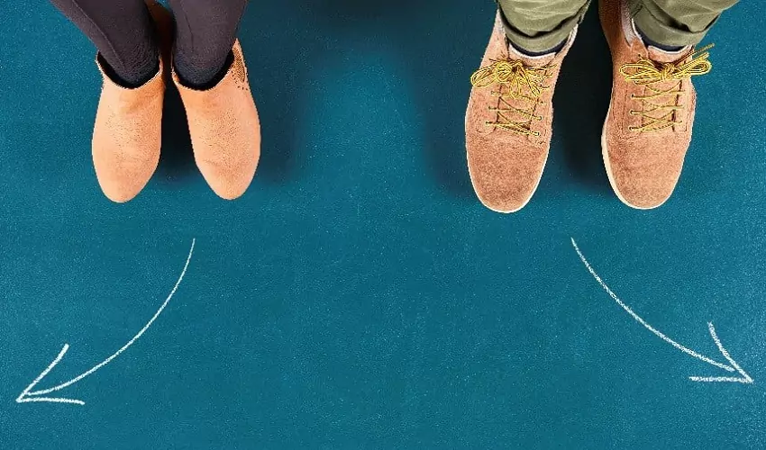 Two pairs of feet pointing in different directions